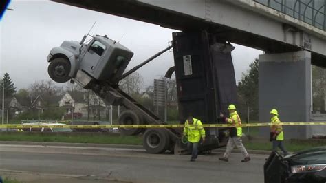 dump truck stuck under bridge today youtube